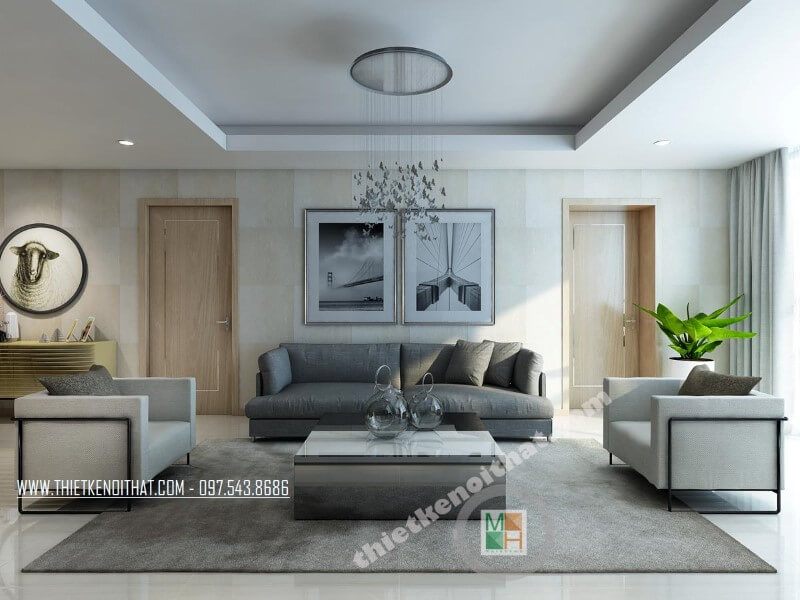 của bạn Bộ sofa bọc vải cao cấp gồm một chiếc ghế sofa dài màu xám và hai ghế đơn màu xám sẽ làm nổi bật phòng khách chung cư của bạn.